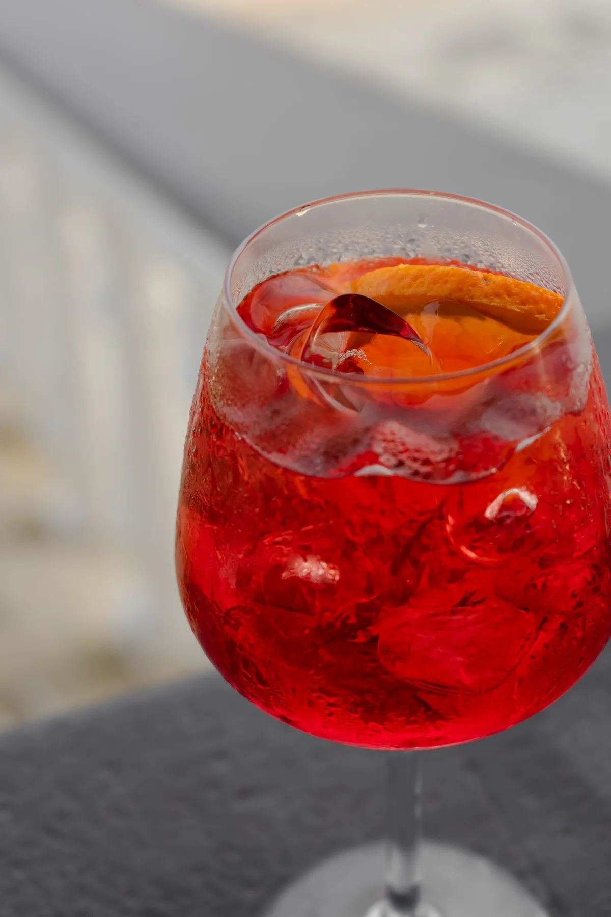 Cherry Spritz, deep red over ice